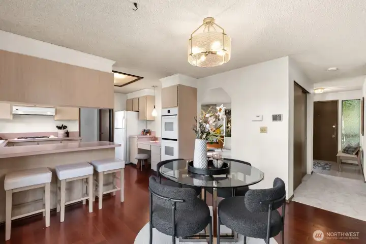 Dining area sits just off main living area and down hall from entry.