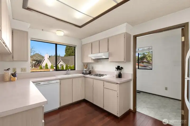 Kitchen sits off laundry room with huge pantry!