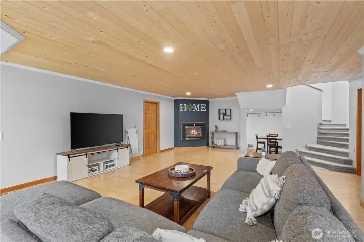 Inviting living room with fireplace and comfortable layout designed for everyday living and entertaining in the Pacific Northwest.