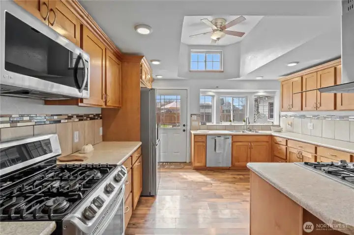 Chef-inspired kitchen featuring dual ovens, propane range, and functional layout designed for entertaining and meal prep.