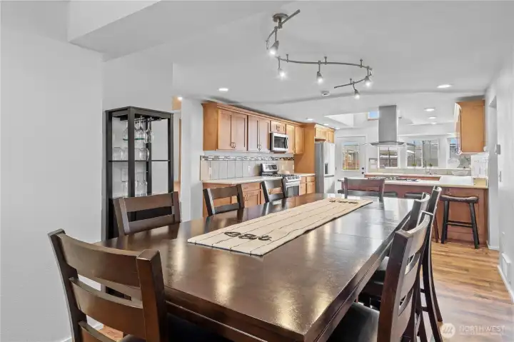 Large dining area with modern farmhouse touches and open-concept design for seamless entertaining.