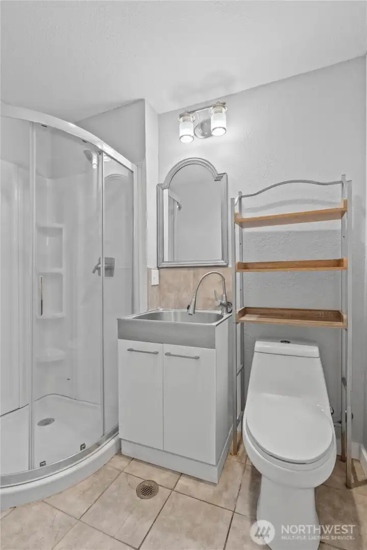 Clean and functional bathroom with modern updates and bright finishes.