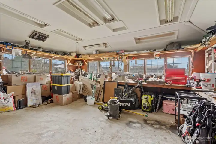 Large attached shop with ample space for tools, storage, or workshop—perfect for hobbyists or business use.