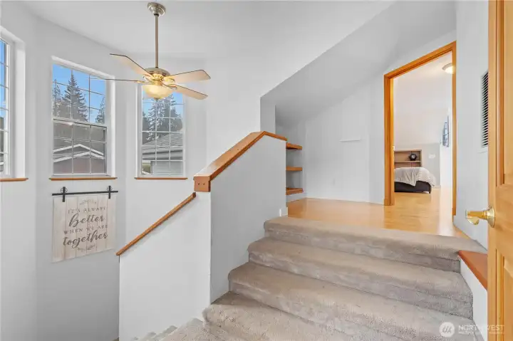 Welcoming stairway leading to private upper-level retreat.