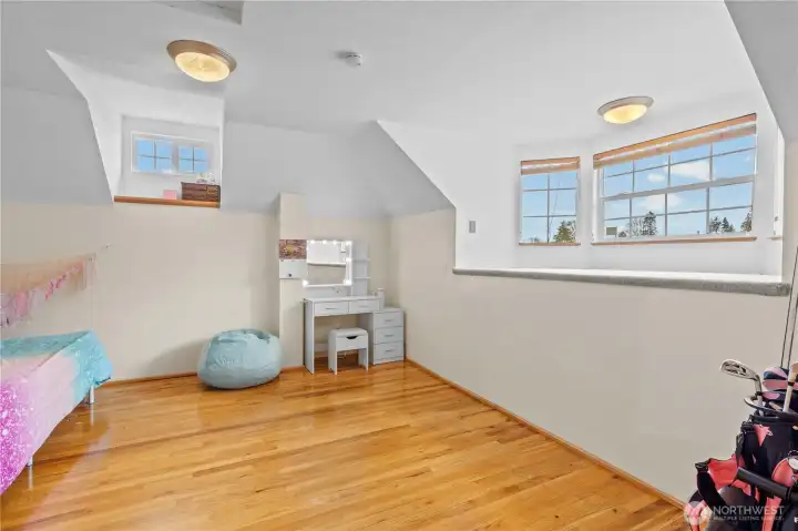 Additional upper-level room with natural light and versatile use options.