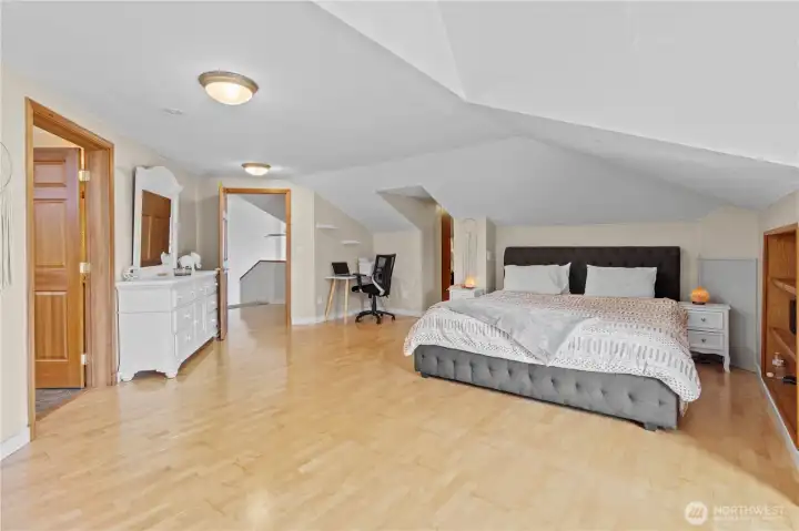 Primary bedroom featuring generous space and natural light for a relaxing atmosphere.