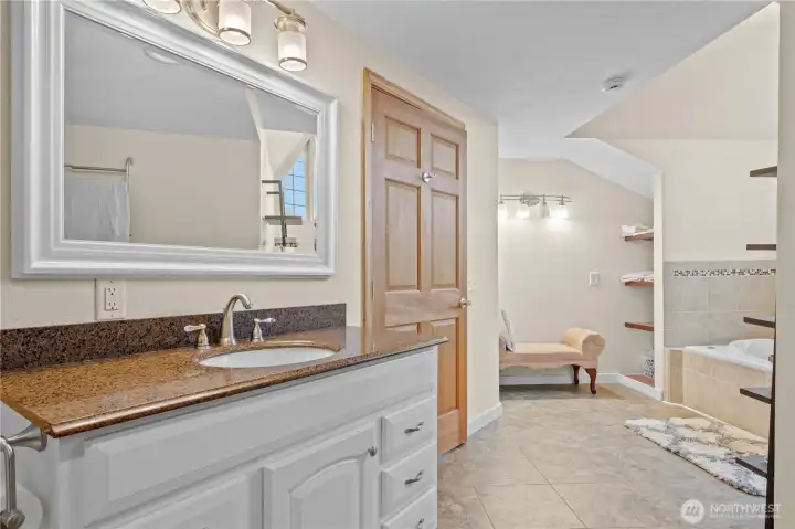 Bright and clean bathroom with updated finishes and ample storage.