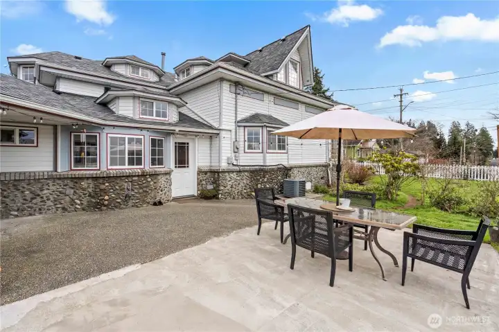 Beautiful backyard with patio, string lights, and entertaining space—classic Pacific Northwest outdoor living.