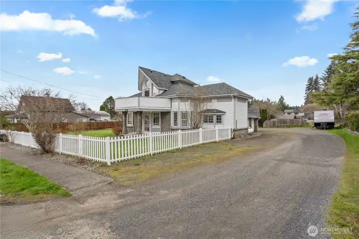 Side yard with fencing and additional usable space—great for storage, gardening, or pets.