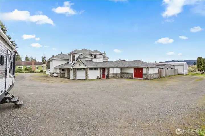 Extended driveway with RV parking and additional space for vehicles, trailers, or toys.