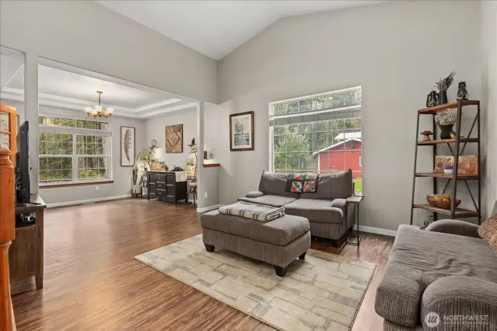 Natural light fills the main living space, with an easy flow into the dining area—creating a layout that feels connected yet defined.