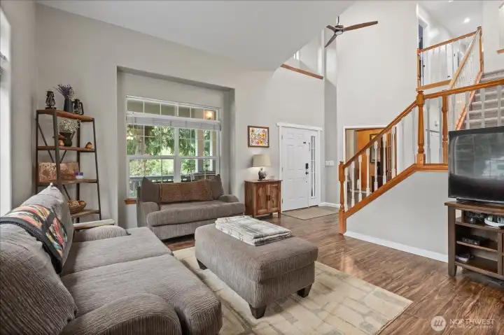 From this angle, the openness of the home really comes through, with sightlines connecting the living area, entry, and upper level.