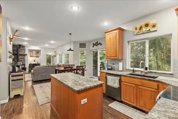 The open layout creates an easy flow between living, dining, and kitchen spaces, making everyday living and entertaining feel seamless.