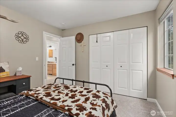 Spacious bedroom with convenient access to nearby bath.