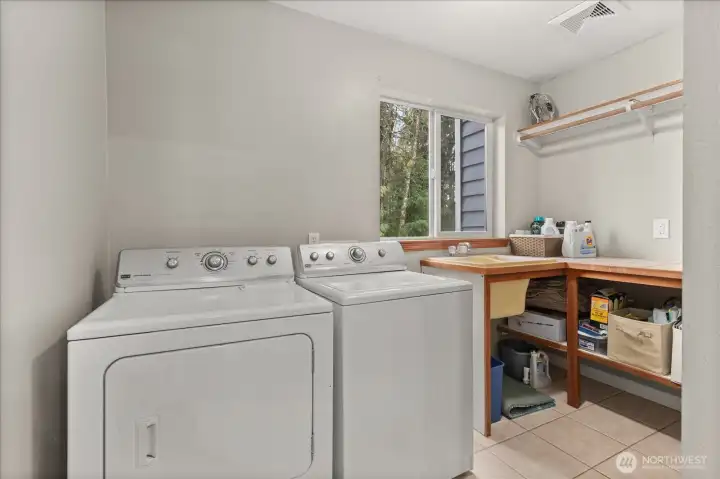 Conveniently located upstairs, the laundry room is positioned near the bedrooms for everyday ease.
