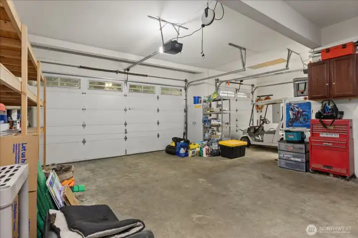 Spacious attached garage with room for parking, storage, and projects.