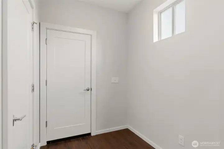 Mudroom with door to the garage and pantry