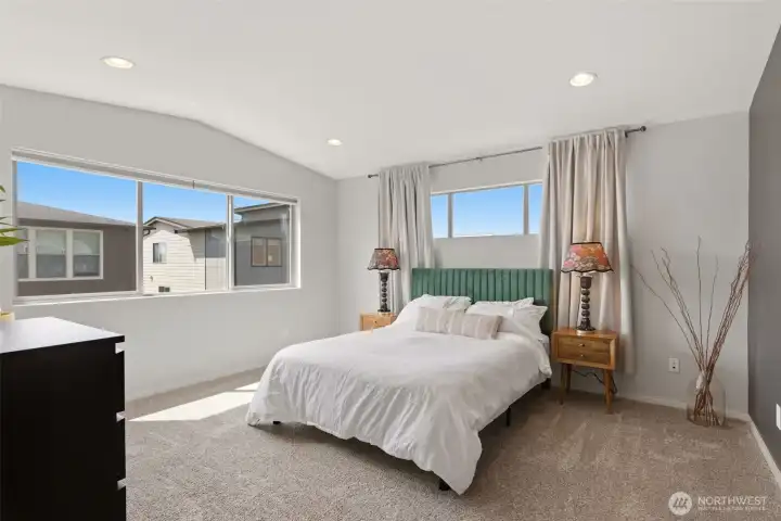 Primary suite with vaulted ceilings is your new cozy sanctuary