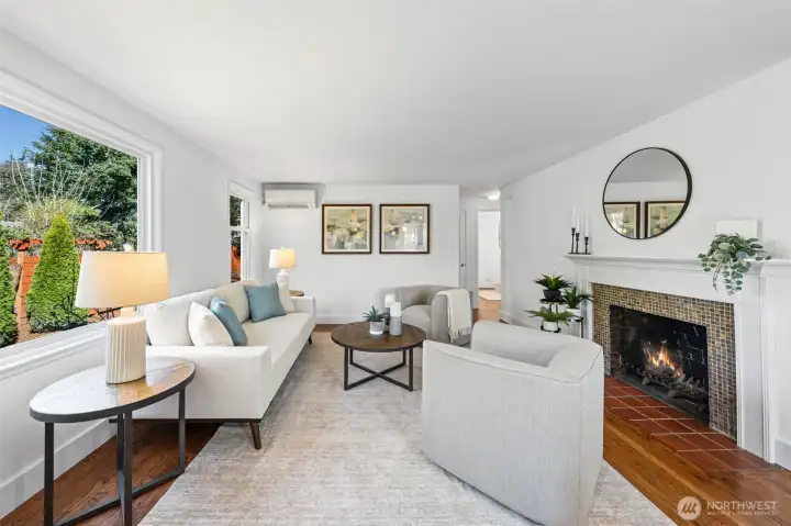 Relax in your cozy & bright Living Room featuring a minisplit unit for heating and cooling.