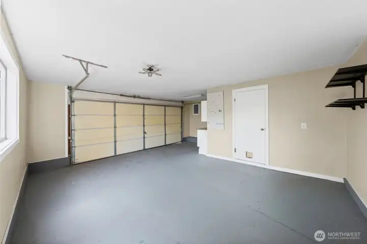Exceptional 2-car garage with epoxy flooring, a rare find in Seattle!