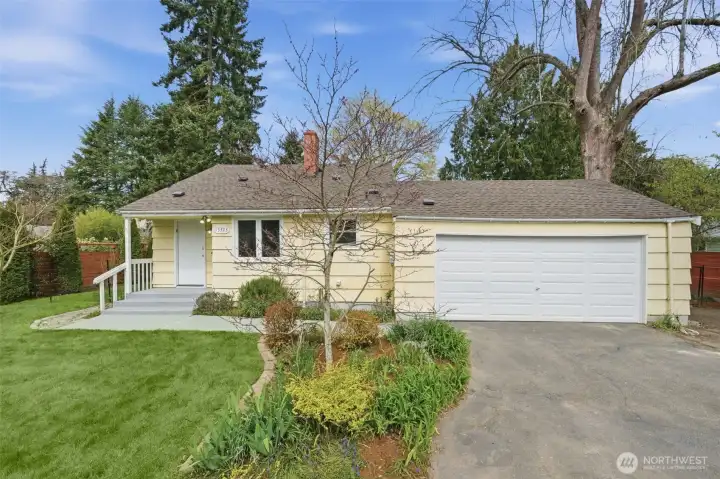 Just in time for summer, this home and lot is a Gardener's delight!