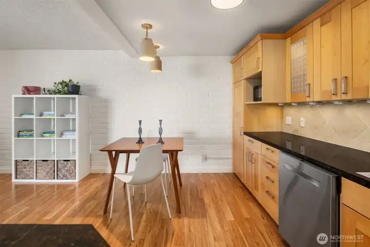 Open dining area accented by stylish new lighting fixtures.