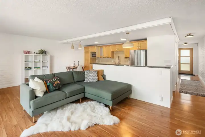 Easy care hardwood-style flooring flows throughout.