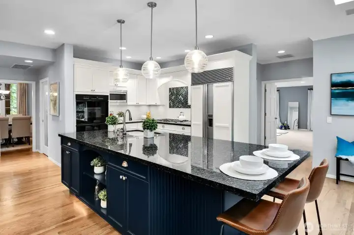 Top of the line appliances: Sub-Zero fridge, double Dacor ovens, Dacor 5 burner gas cooktop, granite counters, Insta-Hot.
