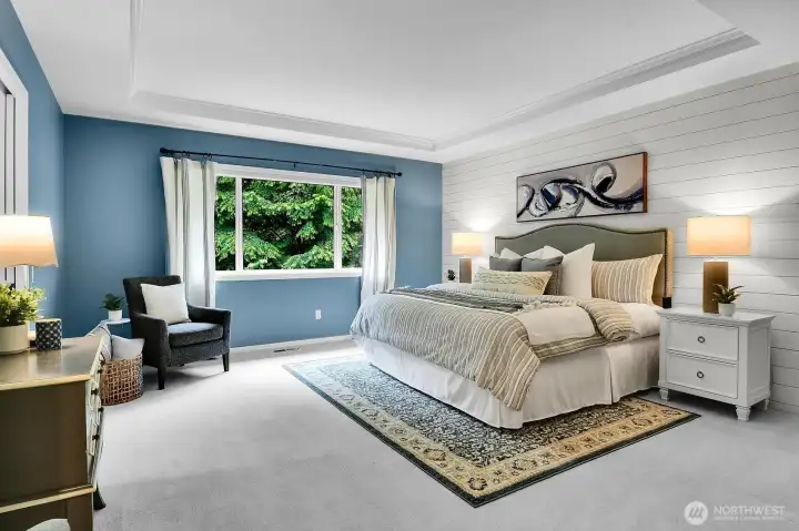 The primary suite overlooks the serene rear yard with total privacy.