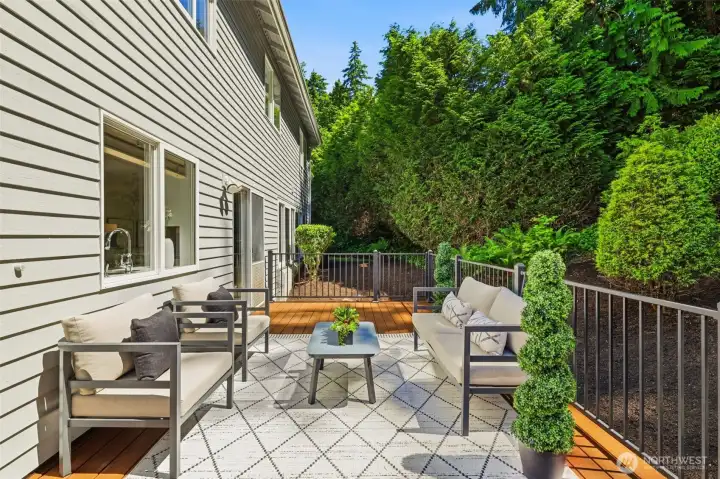A low-maintenance deck surrounded by tranquil green space, perfect for relaxing or entertaining. A low-maintenance deck surrounded by tranquil green space, perfect for relaxing or entertaining.