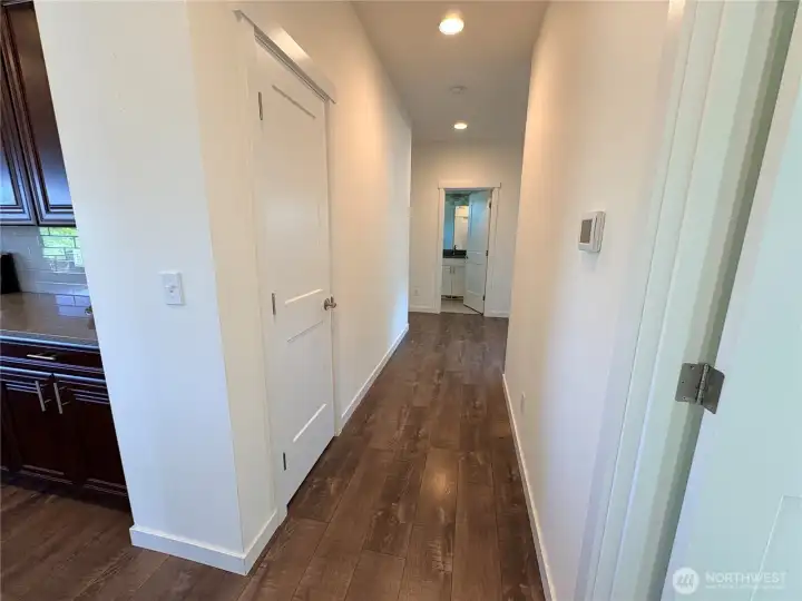 Hallway to Bedrooms from Kitchen on left-Laundry on Right