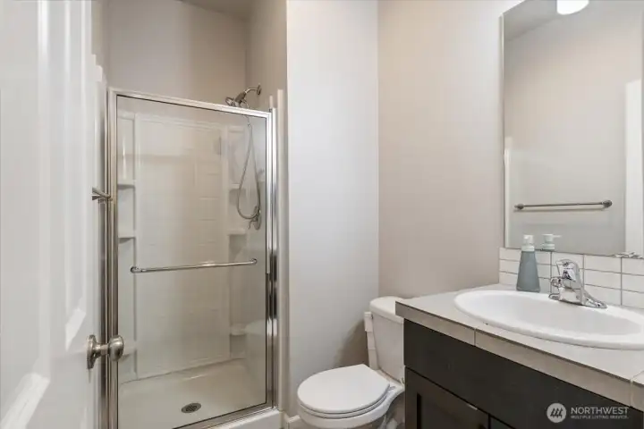 Main floor guest bathroom with Shower outside of main floor bedroom.
