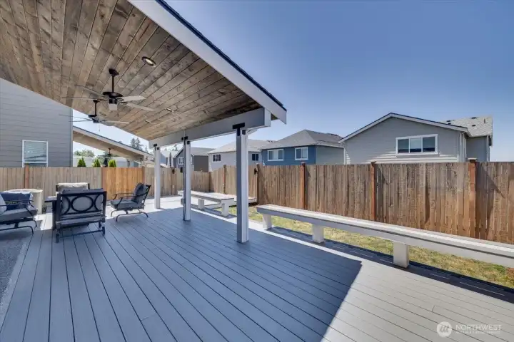 Check out this covered deck with lighting, ceiling fans and Pine wood lining the underneath giving that extra warmth!