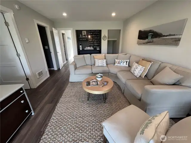 Lower level family room features a coffee bar.