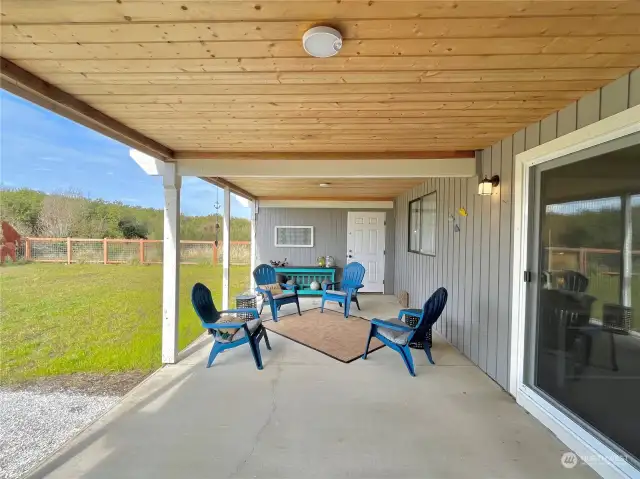 Main level covered patio gets all the afternoon sun.  Protected from winds, a great place to spend rainy days or sunny days.  Maybe a perfect spot for a future hot tub?