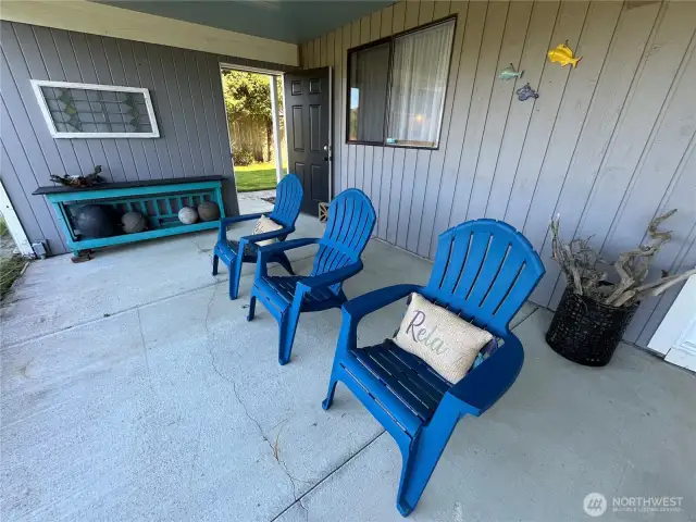 Covered back patio located just off the lower level family room can be used year round.