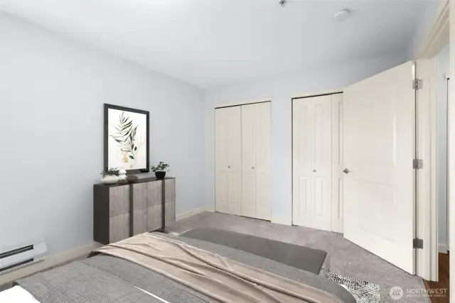 Second bedroom. The entire east-facing wall features double-doors to a closet with built-ins