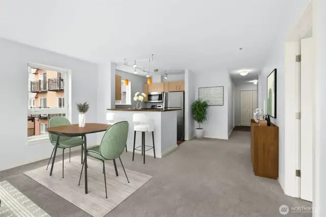 Living room facing breakfast bar & kitchen