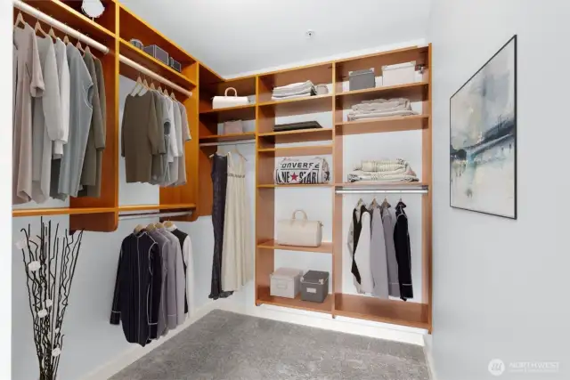 HUGE walk-in closet in the primary bedroom with thoughtfully-designed built-ins