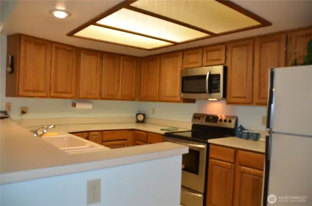 Nice sized kitchen has, stove, dishwasher, trash compactor, microwave, refrigerator and garbage disposal