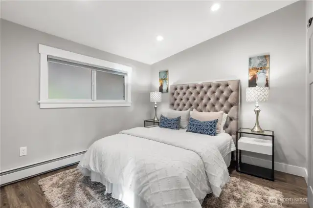The main-floor primary suite features a vaulted ceiling.