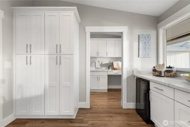 Just off the main kitchen, this butler's pantry has a beverage cooler & storage galore.
