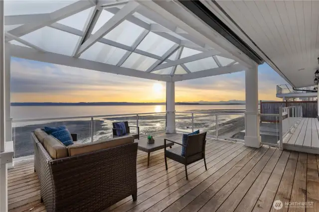 Savor panoramic views from the deck with the majestic Olympics rising in the background.