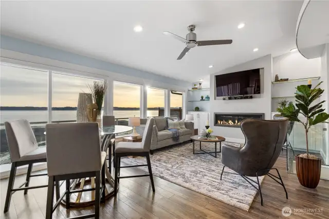 Great room spanned by windows and a slider to the deck & patio.