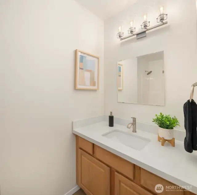 Full bath on main floor with quartz countertops