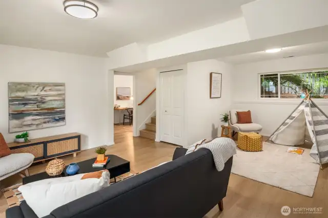 Very spacious family room leads to 3/4 bath and office space.