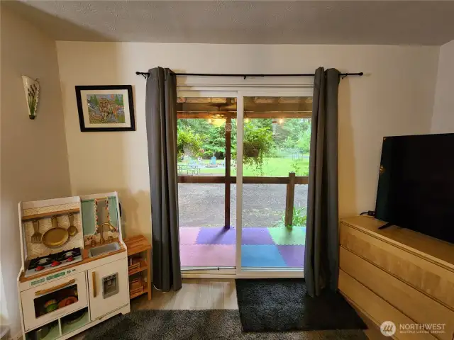 bedroom area with view through sliding glass door