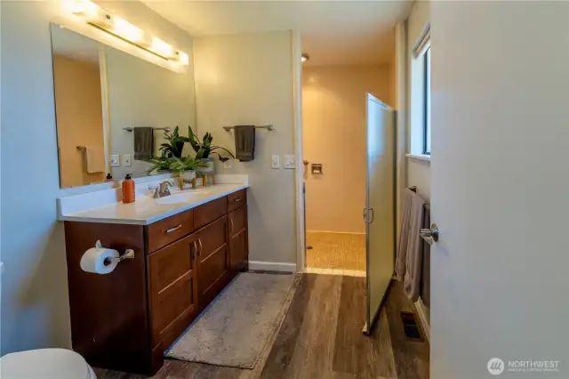 Bath with zero-step shower