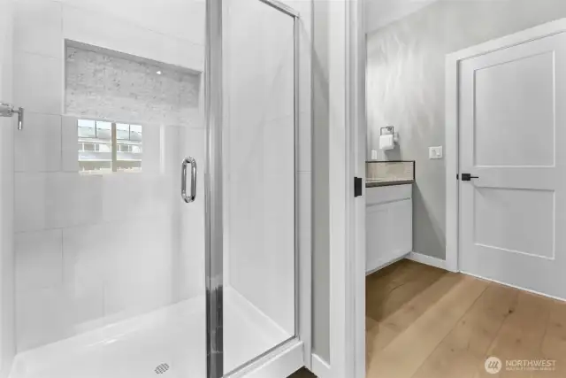 Main floor 3/4 bathroom. Pictures depict a previously built home similar to the home going to be built on this lot. Floor plans, Elevations, colors, upgrades & materials may be different.
