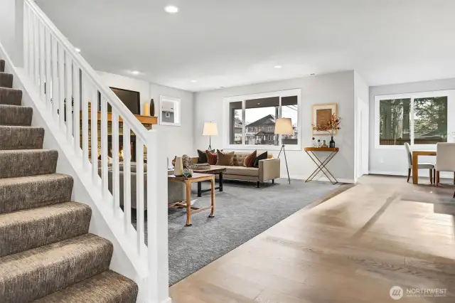 Family room and stairs. Pictures depict a previously built home similar to the home going to be built on this lot. Floor plans, Elevations, colors, upgrades & materials may be different.